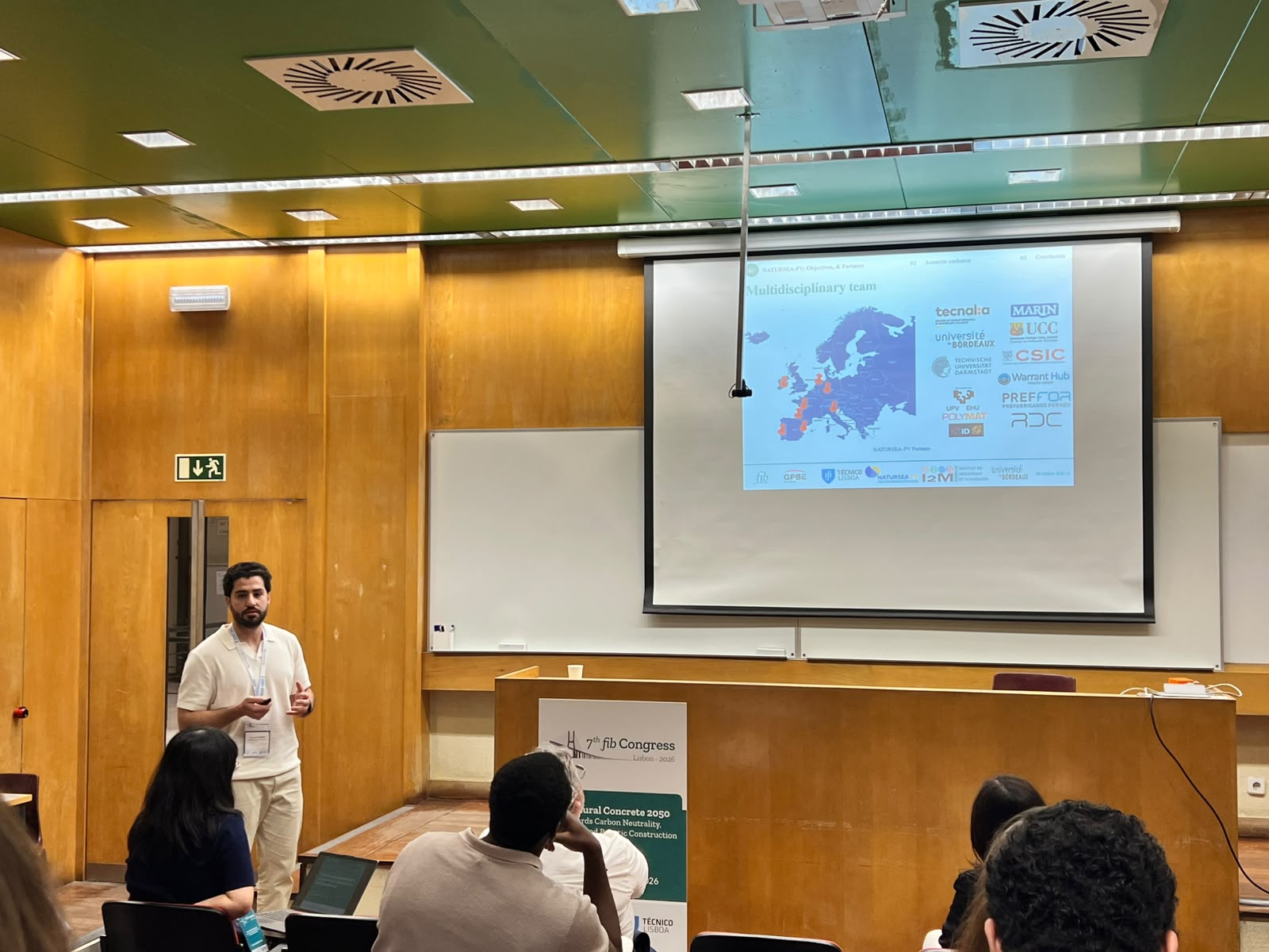 Youssef Sleiman (Université de Bordeaux, I2M Laboratory) presenting NATURSEA-PV research on geopolymer UHPC durability at the 7th fib Congress in Lisbon, June 2026